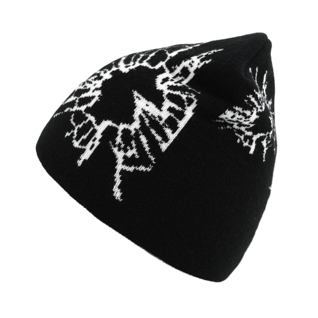 Black beanie with white floral patterns on a white background