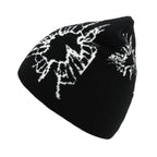 Black beanie with white floral patterns on a white background